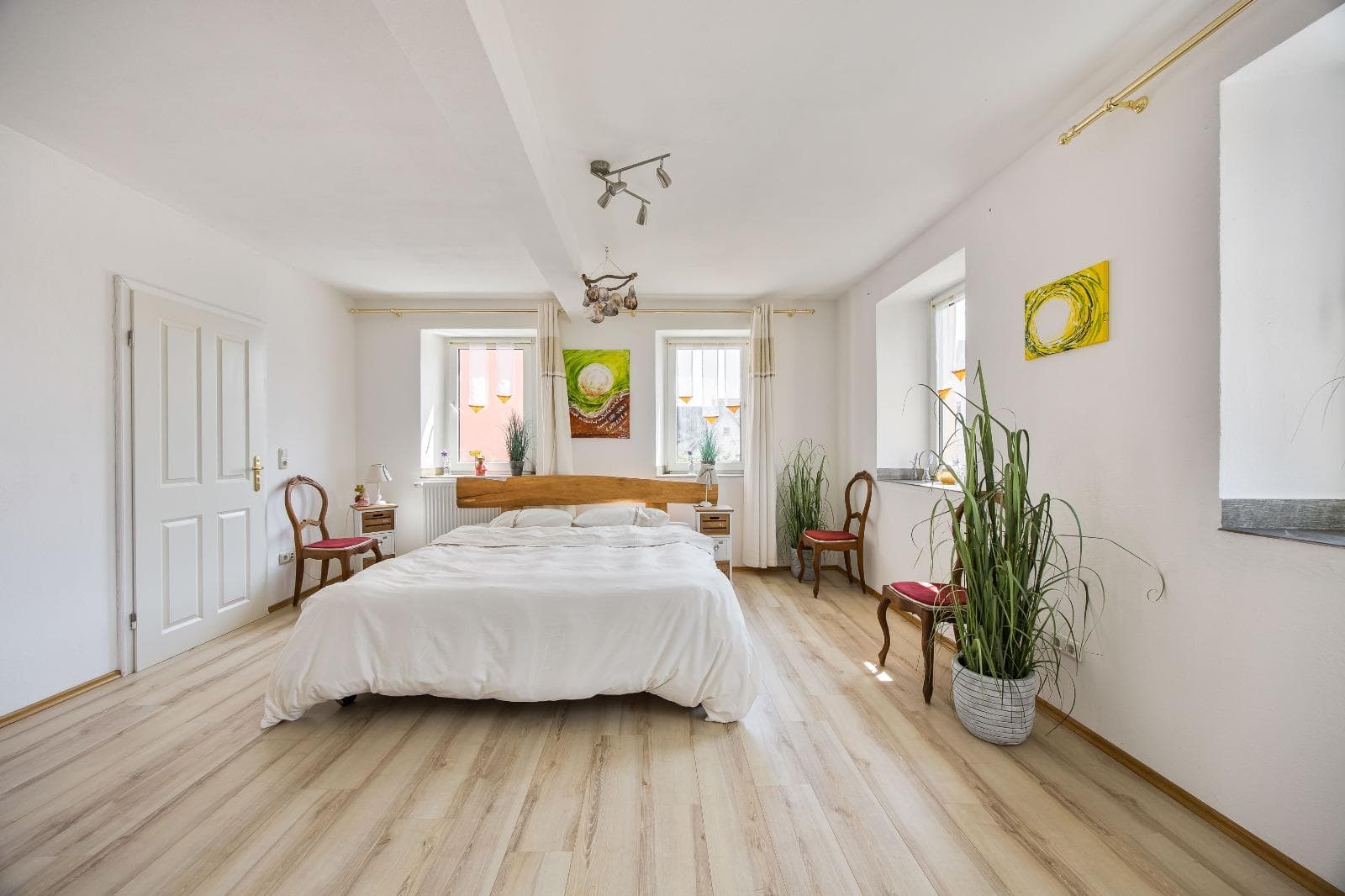 Cosy room with wood stove and white linens